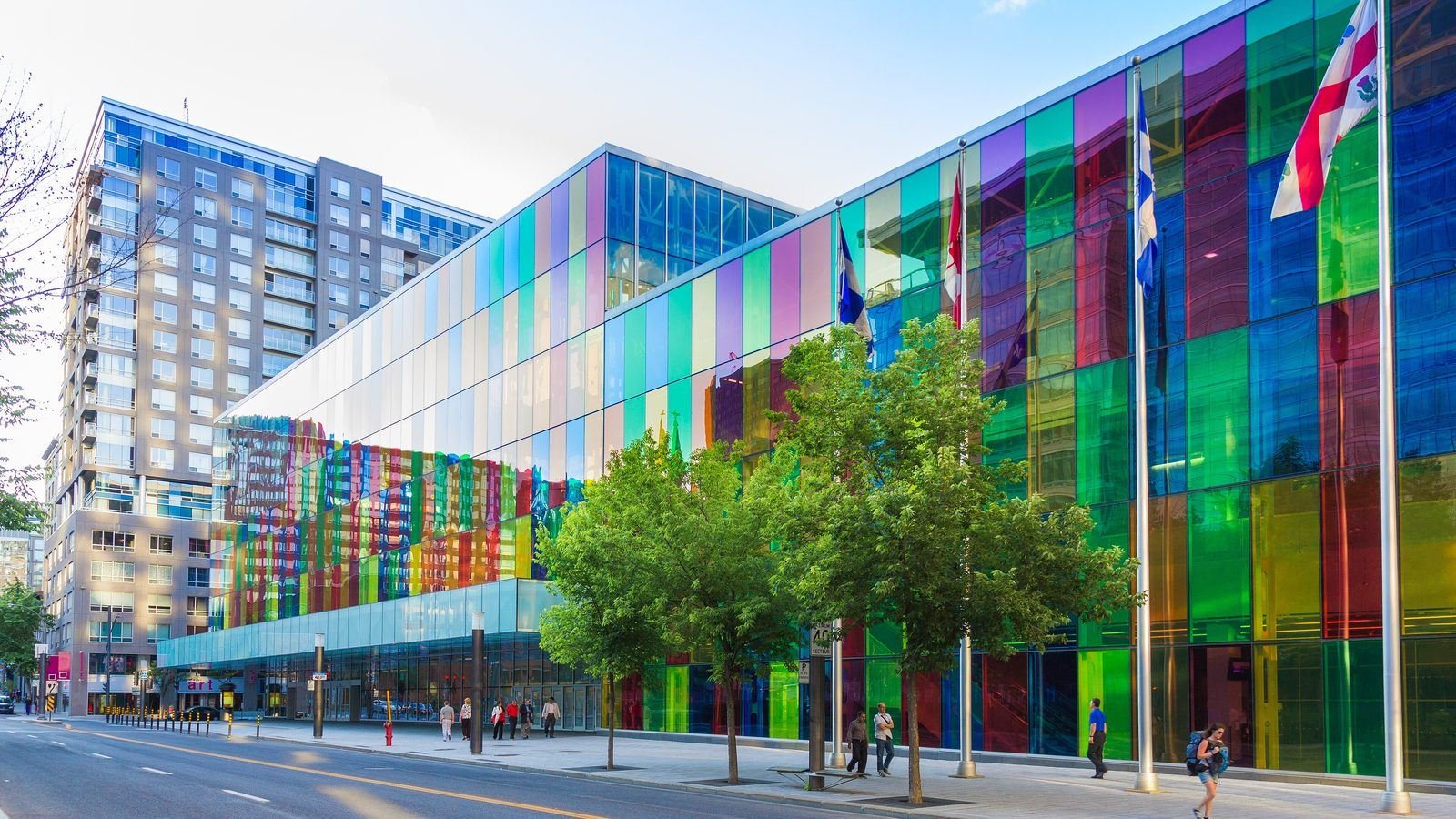 The coloured-glass facade of the Palais des congrès de Montréal in the summit’s host city (illustrative; not confirmed as the summit venue) — Photo: congresmtl.com, CC BY-SA 2.0, via Wikimedia Commons